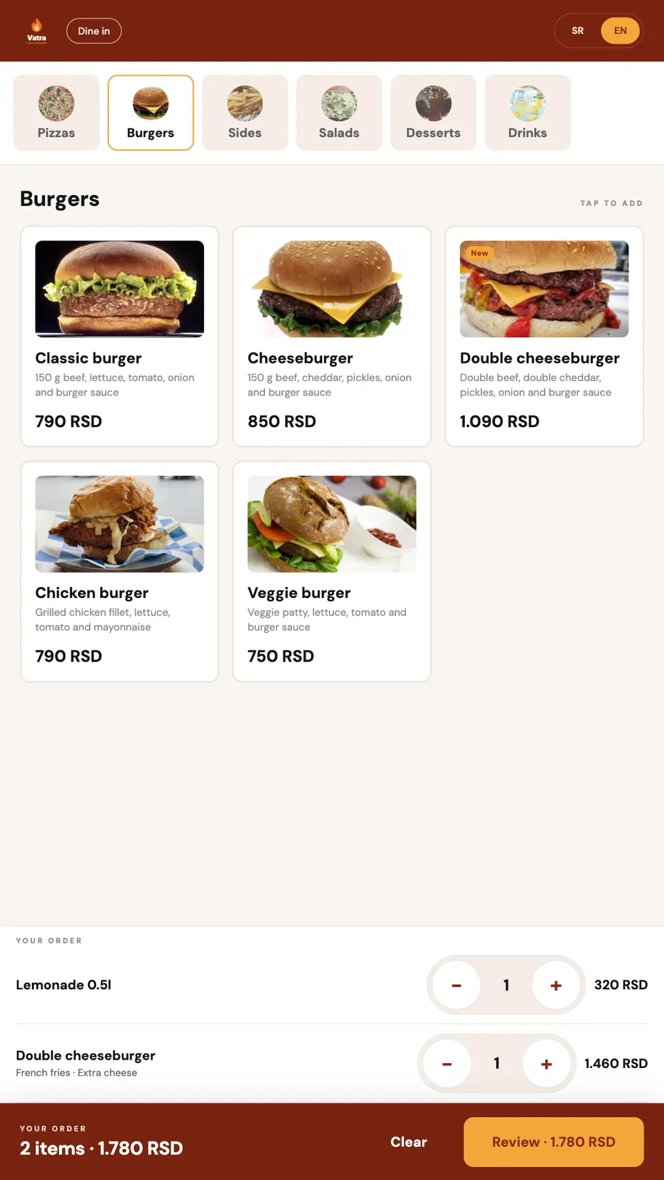 Orbi Kiosk in English: the burger menu with photos and a cart with a double cheeseburger and a lemonade.